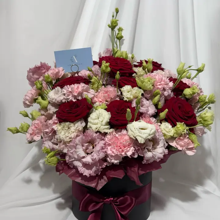 Red rose and pink carnation hatbox arrangement