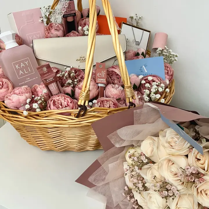 Pink flower basket hamper with a cream rose bouquet