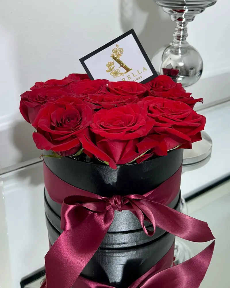 Red rose hatbox with a burgundy ribbon