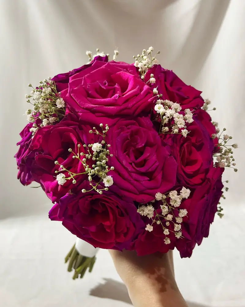 Deep pink rose bridal bouquet with gypsophila
