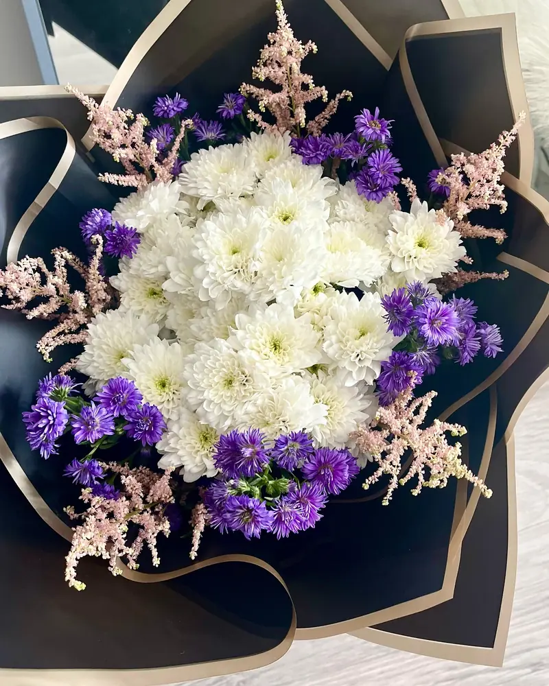 White chrysanthemum and purple statice bouquet